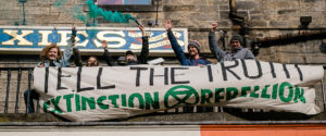 XR Scotland rebels with banner saying: Tell the Truth