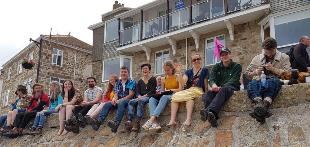 Group of people sitting on a wall